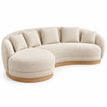 Sof¨¢ curvo tapizado de contorno redondeado, beige y marr¨®n
